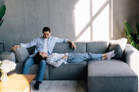 A picture of a couple inside a house.