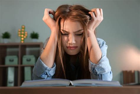 A picture of a girl having difficulties studying.